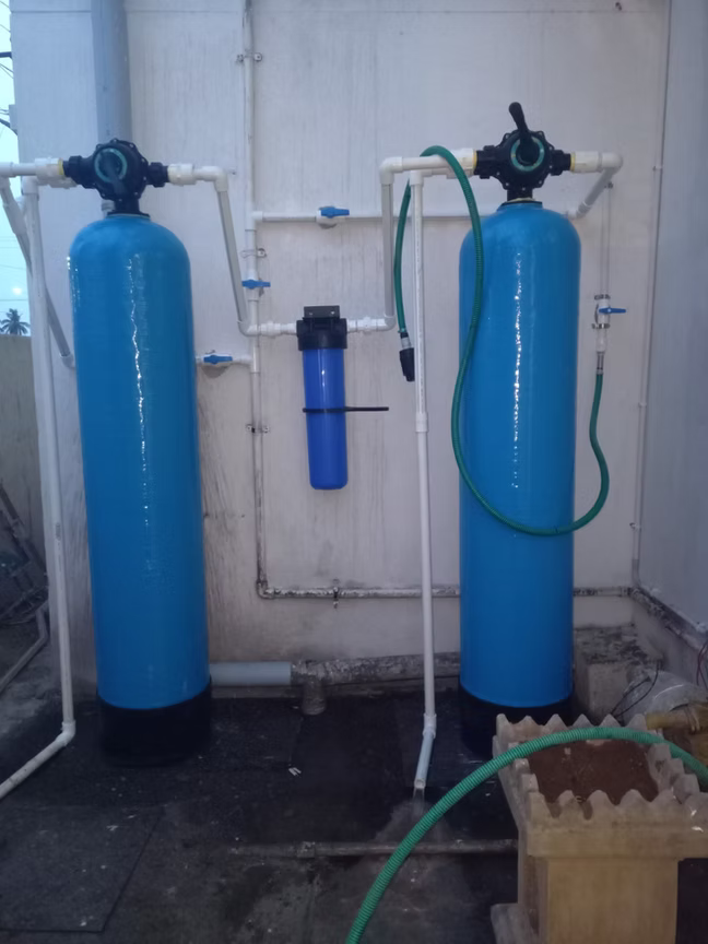 Water softener system installed indoors
